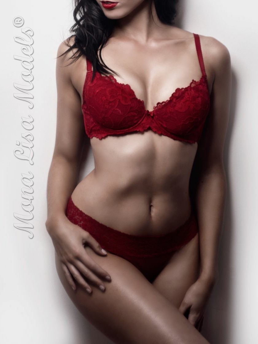 Model posing for Dural escorts in red lingerie